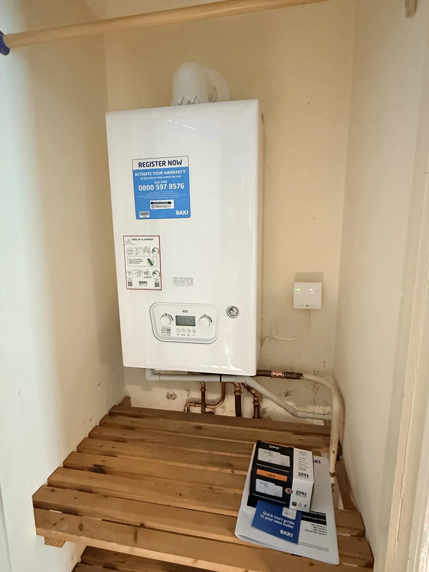 Baxi 400 boiler neatly installed in a utility cupboard