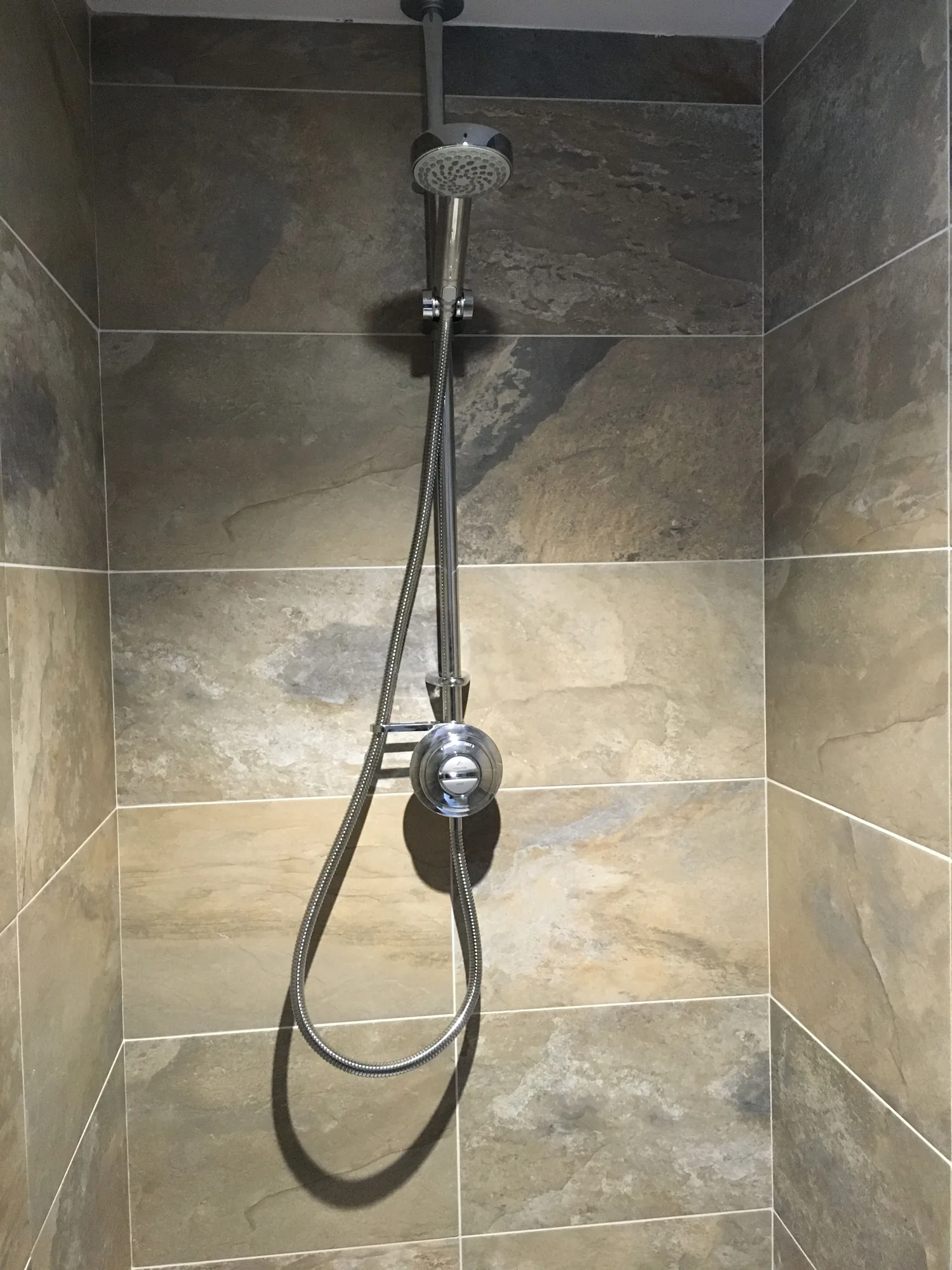 New shower with a chrome riser rail and thermostatic valve fitted by PARAGAS